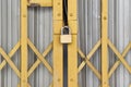 Locked padlock on gold metal door Royalty Free Stock Photo