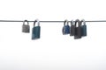 Locked padlocks hanging on a metal rope. Royalty Free Stock Photo