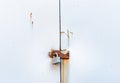 Locked simple metal padlock hanging on rusted hasp on metal doors. Royalty Free Stock Photo
