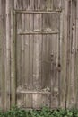 Locked wooden door of an old wooden house. texture of wood Royalty Free Stock Photo