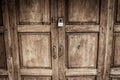 Locked wooden door with silver padlock Royalty Free Stock Photo