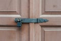 Locked wooden doors with black metal lock Royalty Free Stock Photo