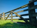 Locked wooden fence gate at farm.