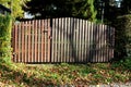 Locked wooden picket fence gate