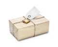Locked wrapped package in gold striped paper.