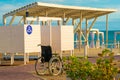 Locker room wheelchair sea beach holiday disabled happy travel family lifestyle, from vacation disability for water from Royalty Free Stock Photo