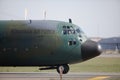 Lockheed C-130 Hercules military cargo plane of the Romanian Air Force on Henri Coanda International Airport Royalty Free Stock Photo