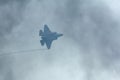Lockheed Martin-F-35 Lightning II flying through the smoke