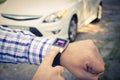 Locking the car with smart watch app Royalty Free Stock Photo