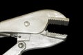 Locking Pliers isolated on black background Royalty Free Stock Photo