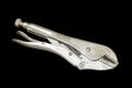 Locking Pliers isolated on black background Royalty Free Stock Photo