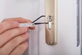 Lockpicker Hand Fixing Door Handle At Home Royalty Free Stock Photo