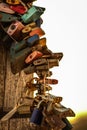 Locks of love attached to the cross on Jested at sunrise