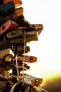 Locks of love attached to the cross on Jested at sunrise