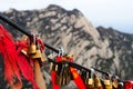 Locks with red bows on mountain Huashan in China Royalty Free Stock Photo