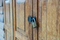 Lockset on wooden door pattern textured background, antique place in Thailand. Royalty Free Stock Photo