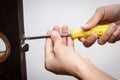 Locksmith fix lock on wooden door Royalty Free Stock Photo