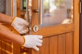 Locksmith Fixing Lock Door of Dining Room. Royalty Free Stock Photo
