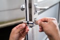 Locksmith Lock Door Repair. Worker Changing Royalty Free Stock Photo