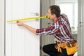 Locksmith, man and maintenance, handyman with home renovation and fixing, change door locks with power tools