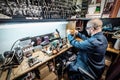 Locksmith working on key duplicating machine in workshop Royalty Free Stock Photo