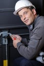 locksmith working on mechanism garage door