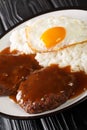 Loco moco is a dish featured in contemporary Hawaiian cuisine consists of white rice, topped with a hamburger, a fried egg, and Royalty Free Stock Photo