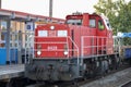 Locomotive carrying stones for train rails during maintenance work