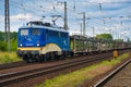 Locomotive of 140 class from evb Logistik pulls a cargo train with empty wagons through Priort