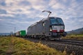 Locomotive freight train driving in the countryside