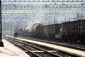 Locomotive with a freight train at a railway station Royalty Free Stock Photo