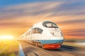 Locomotive high speed train runs on rail track, sunset sky