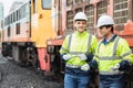 Locomotive repair worker happy relax talking with friend team after finish working service old train on the Railway track outdoor Royalty Free Stock Photo