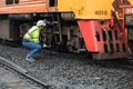 Locomotive repair worker, Train Engineer technician on duty working Maintenance Rolling Stocks of old diesel train passenger cabin Royalty Free Stock Photo