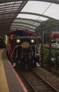 Locomotive of the romantic Sagano Scenic Railway arriving at Saga-Arashiyama station Royalty Free Stock Photo