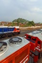 A locomotive towing a long series of coal at the Tanjung Karang Locomotive Depot, Lampung, Indonesia