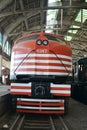 Locomotive, restored red and white V8, front view on boarding platform in museum, Brazil, South America