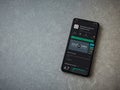 SoloLearn - Learning coding app play store page on the display of a black mobile smartphone on ceramic stone background