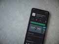 SoloLearn - Learning coding app play store page on the display of a black mobile smartphone on ceramic stone background