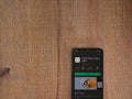 VSCO - Photo and Video Editor app play store page on mobile smartphone on wooden background