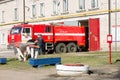 LODEYNOJE POLE, RUSSIA - MAY 2TH, 2016: Unidentified firefighters washing their fire truck