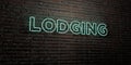 LODGING -Realistic Neon Sign on Brick Wall background - 3D rendered royalty free stock image Royalty Free Stock Photo
