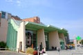 Lodi hospital. Entrance to the modern green painted hospital. Pharmacy cross sign