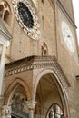 Rose window and windows of the cathedral of lodi. Exterior of the large church made of terracotta bricks in the Romanesque style