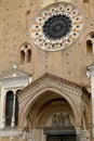 Rose window and windows of the cathedral of lodi. Exterior of the large church made of terracotta bricks in the Romanesque style