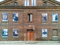 Facade of building at Ksiezy Mlyn with old photos at windows Royalty Free Stock Photo