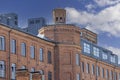 Facade of restored building of former textile factory in urban complex Ksiezy Mlyn (Priest\'s Mill), Lodz, Poland Royalty Free Stock Photo