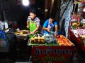 LOEI - JANUARY 13: Unidentified couple selling grilled sticky rice in Chiang Khan night street market on January 13, 2019 in Loei