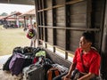 Unacquainted porter man waiting trekkers to pick them Bag on Phu Kradueng mountain national park in Loei City Thailand Royalty Free Stock Photo