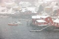 Reine fishing village on Lofoten islands with red rorbu houses in winter with snow. Lofoten islands, Norway, Europe Royalty Free Stock Photo